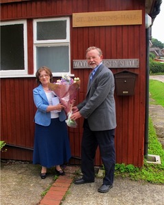 The Chairman presenting bouquet to Barbara